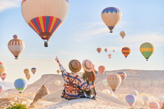 People watching hot air balloons